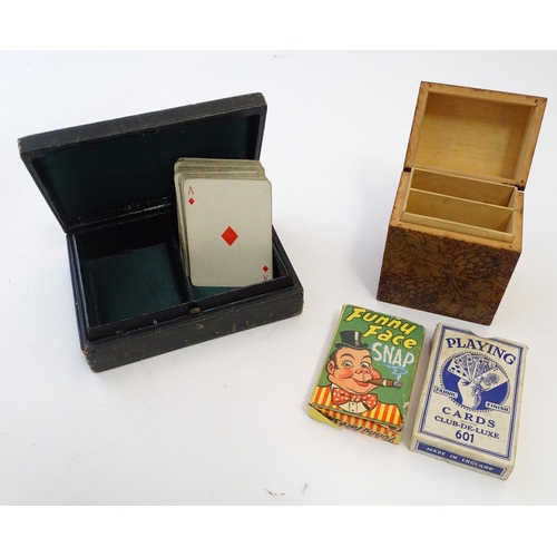 697 - Toys: An early 20thC pokerwork double card box with floral decoration, containing a pack of Club de ... 