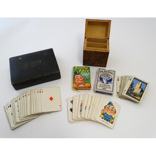 697 - Toys: An early 20thC pokerwork double card box with floral decoration, containing a pack of Club de ... 