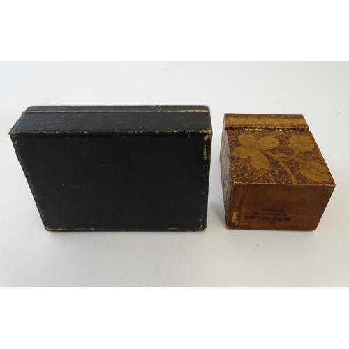 697 - Toys: An early 20thC pokerwork double card box with floral decoration, containing a pack of Club de ... 