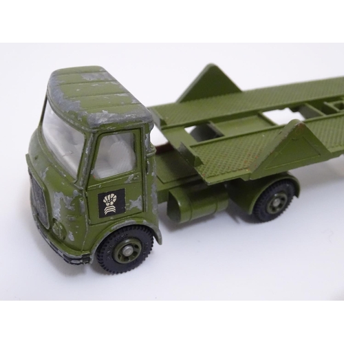 700 - Toys: A quantity of Dinky Toys die cast scale model military vehicles comprising AEC Articulated Lor... 