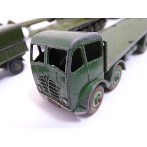 700 - Toys: A quantity of Dinky Toys die cast scale model military vehicles comprising AEC Articulated Lor... 