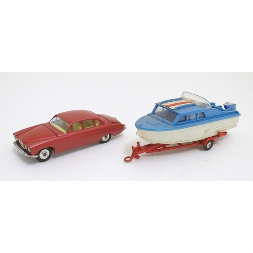 701 - Toys: Two die cast scale model boat and car Corgi Toys to include a Dolphin 20 Cruiser on Wincheon T... 