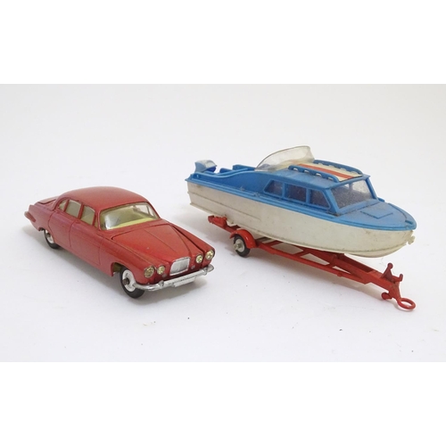 701 - Toys: Two die cast scale model boat and car Corgi Toys to include a Dolphin 20 Cruiser on Wincheon T... 