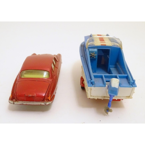 701 - Toys: Two die cast scale model boat and car Corgi Toys to include a Dolphin 20 Cruiser on Wincheon T... 