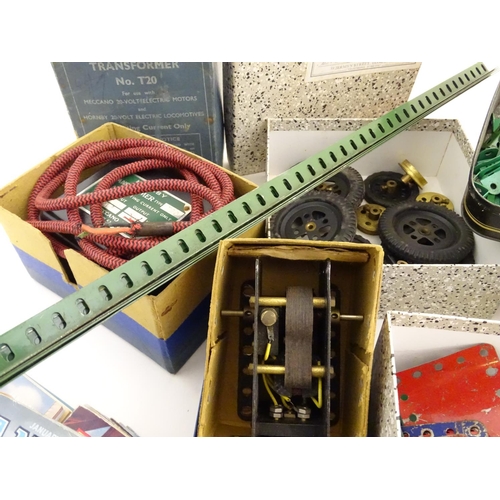 709 - Toys: A quantity of Meccano, to include, wheels, nuts, bolts, screws, washer, axles, plates, gears, ... 