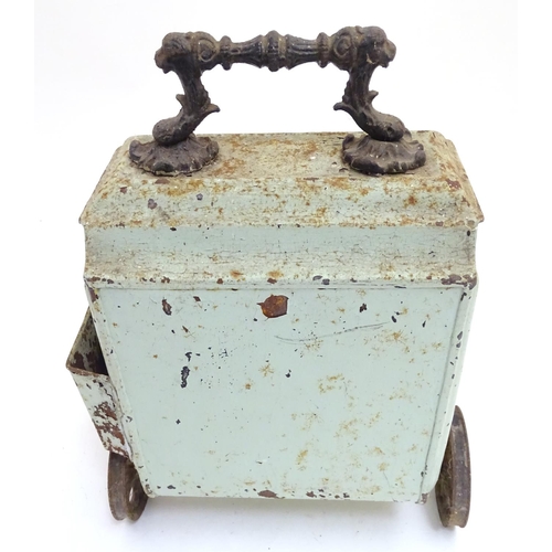 787 - A Victorian tin coal scuttle, the base with wheels and stand, 21