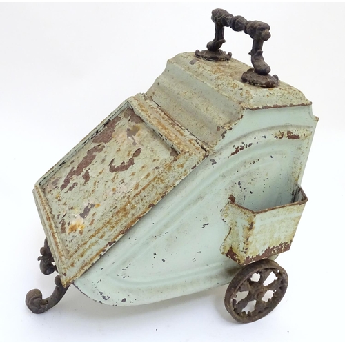 787 - A Victorian tin coal scuttle, the base with wheels and stand, 21