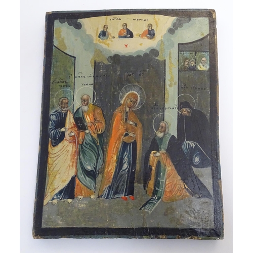 806 - An early 20thC Russian religious icon painted on panel depicting Mary attended by four saints, with ... 