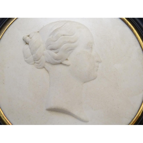 807 - A French 19thC Sevres bisque porcelain / parian ware medallion depicting a profile portrait bust in ... 