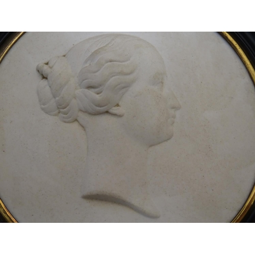 807 - A French 19thC Sevres bisque porcelain / parian ware medallion depicting a profile portrait bust in ... 