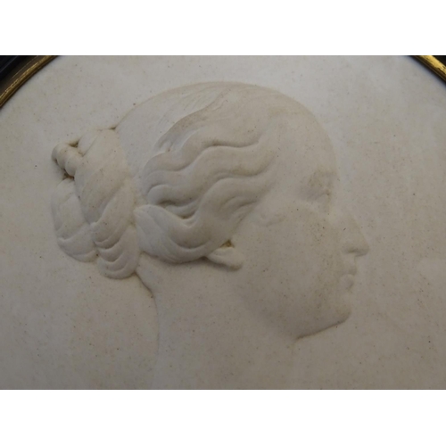 807 - A French 19thC Sevres bisque porcelain / parian ware medallion depicting a profile portrait bust in ... 