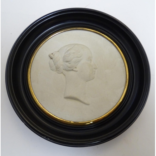 807 - A French 19thC Sevres bisque porcelain / parian ware medallion depicting a profile portrait bust in ... 