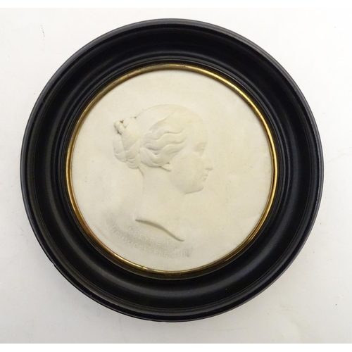 807 - A French 19thC Sevres bisque porcelain / parian ware medallion depicting a profile portrait bust in ... 