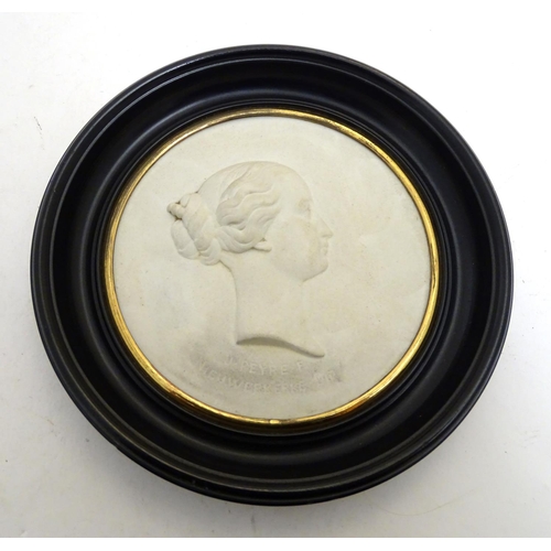 807 - A French 19thC Sevres bisque porcelain / parian ware medallion depicting a profile portrait bust in ... 