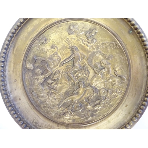 822 - A cast decorative plate depicting the triumph of the sea god Neptune in his chariot with mermaid and... 