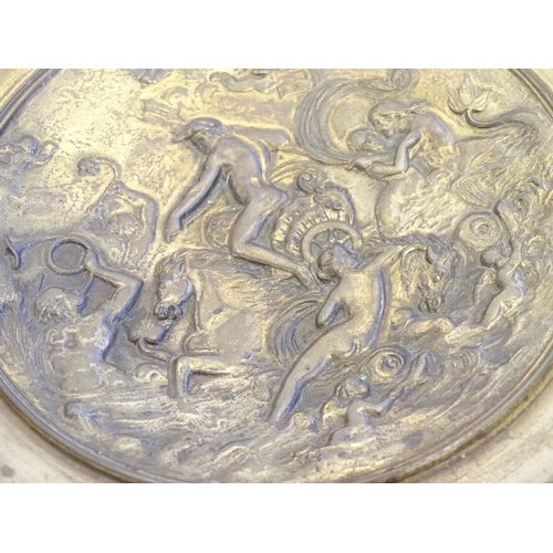 822 - A cast decorative plate depicting the triumph of the sea god Neptune in his chariot with mermaid and... 