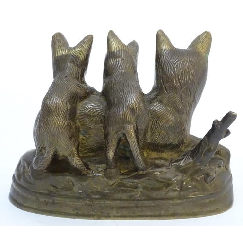 823 - A Continental cast sculpture depicting a fox and two fox cubs with traces of gilt finish. Approx. 4 ... 