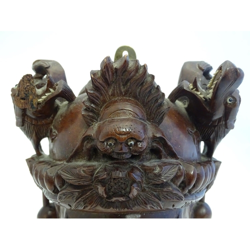 842 - A 20thC Chinese carved hardwood mask with carved dragon detail and inset eyes. Approx. 10 1/4