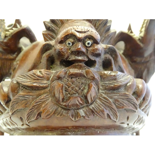 842 - A 20thC Chinese carved hardwood mask with carved dragon detail and inset eyes. Approx. 10 1/4