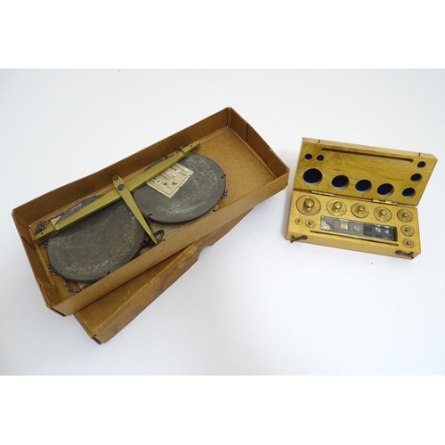 925 - A 20thC set of scientific balance scales by P. Harris & Co. Together with cased weights.