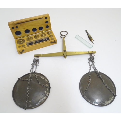 925 - A 20thC set of scientific balance scales by P. Harris & Co. Together with cased weights.