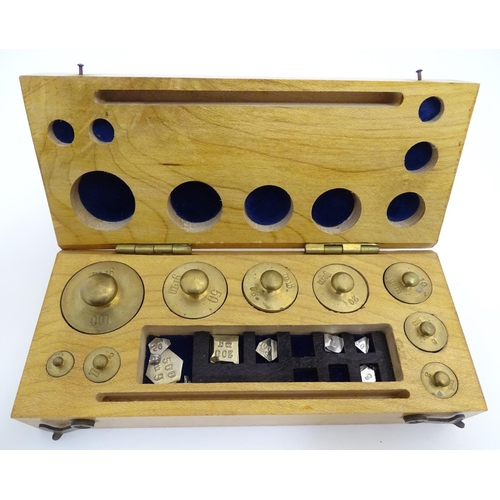 925 - A 20thC set of scientific balance scales by P. Harris & Co. Together with cased weights.