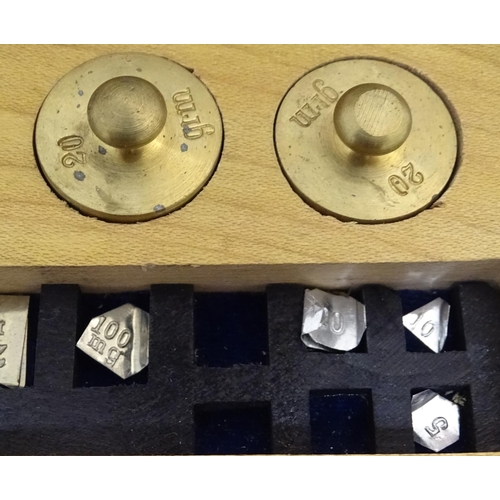 925 - A 20thC set of scientific balance scales by P. Harris & Co. Together with cased weights.