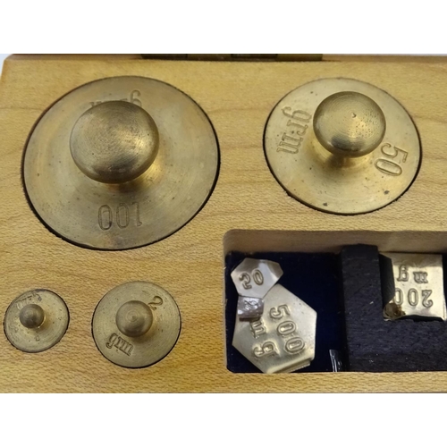 925 - A 20thC set of scientific balance scales by P. Harris & Co. Together with cased weights.