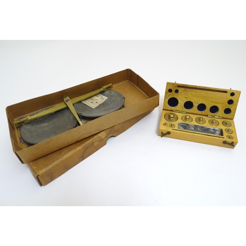 925 - A 20thC set of scientific balance scales by P. Harris & Co. Together with cased weights.