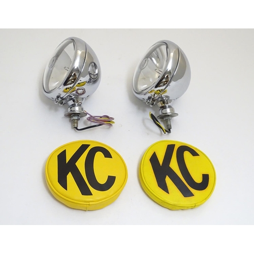 943 - A pair of KC Hilites chromium automotive spotlights with covers, each 6