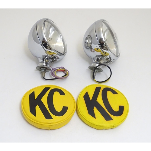 943 - A pair of KC Hilites chromium automotive spotlights with covers, each 6