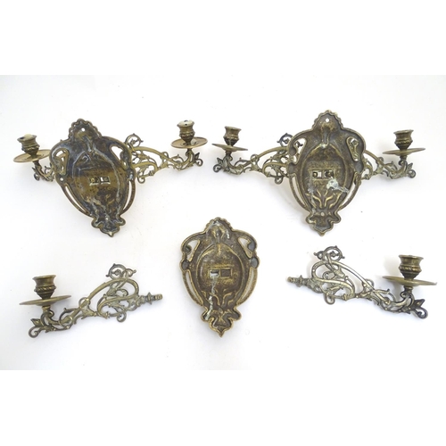 945 - A trio of 19thC brass adjustable double wall sconces, decorated with acanthus fronds and elements of... 