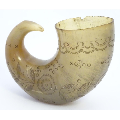 966 - A 19thC rams horn vessel / flask with engraved foliate and roundel decoration. Approx. 4 1/2