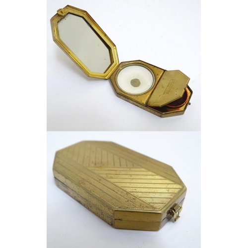 970 - A French Art Deco gilt compact vanity by Houbigant, France, opening to reveal a mirror and two compa... 