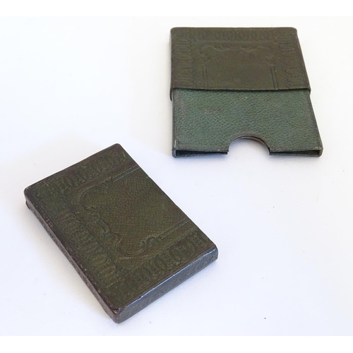 979 - A 20thC green leather card case with embossed decoration. Approx. 3 3/4