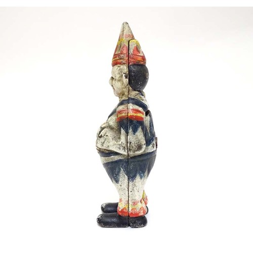 996 - A 21stC cast money box formed as a clown with polychrome decoration. Approx. 5 1/2