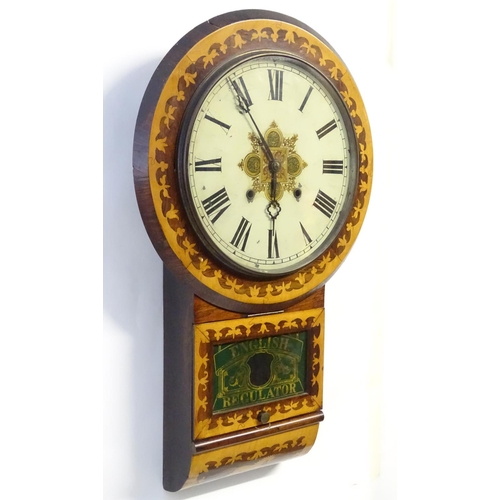 1185 - An American early 20thC 8-day drop dial wall clock, the case decorated with rosewood and boxwood mar... 