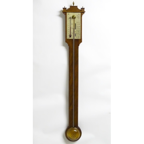 1187 - A mid 20thC stick barometer, the plate marked ' Comitti, Holborn', mahogany case with brass finials.... 