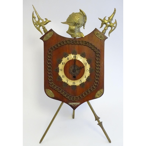 1189 - A late Victorian strut mantle clock, the brass stand formed as crossed halberd and helm, surmounted ... 