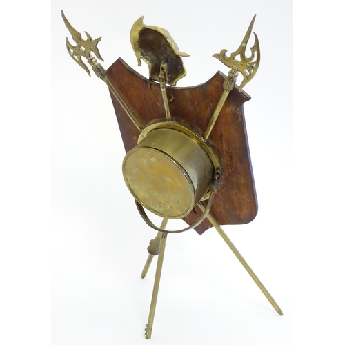 1189 - A late Victorian strut mantle clock, the brass stand formed as crossed halberd and helm, surmounted ... 