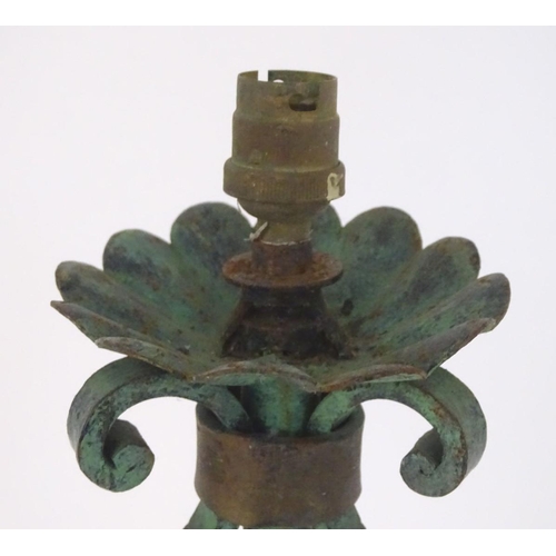 1220 - A late 19th / early 20thC wrought iron standard lamp with a verdigris finish and gilt foliate decora... 