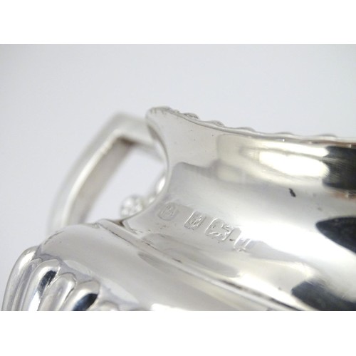 192 - A silver cream jug, hallmarked Birmingham 1910, maker William Aitken. Approx. 2 3/4