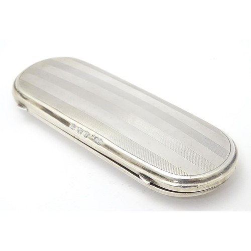 223 - A silver spectacle / glasses case with engine turned decoration. hallmarked Birmingham 1921 maker E ... 