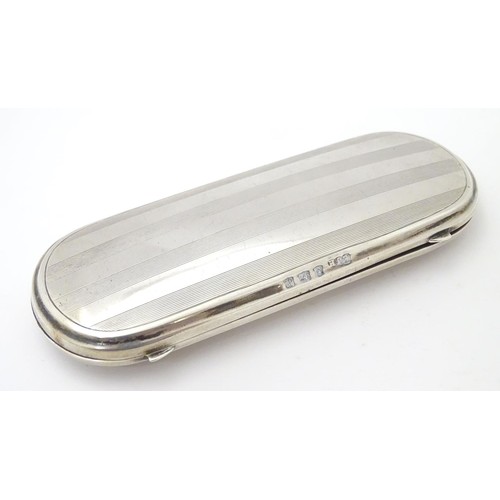 223 - A silver spectacle / glasses case with engine turned decoration. hallmarked Birmingham 1921 maker E ... 