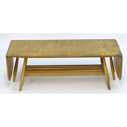 1234 - Vintage Retro, Mid-Century: an Ercol elm and beech coffee table, extending with drop flaps, standing... 