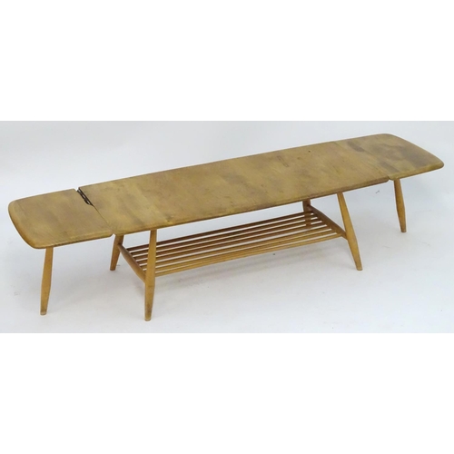 1234 - Vintage Retro, Mid-Century: an Ercol elm and beech coffee table, extending with drop flaps, standing... 