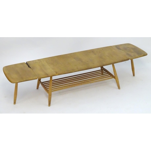 1234 - Vintage Retro, Mid-Century: an Ercol elm and beech coffee table, extending with drop flaps, standing... 