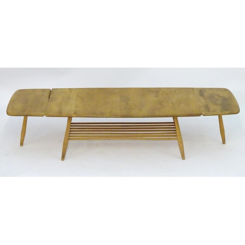 1234 - Vintage Retro, Mid-Century: an Ercol elm and beech coffee table, extending with drop flaps, standing... 