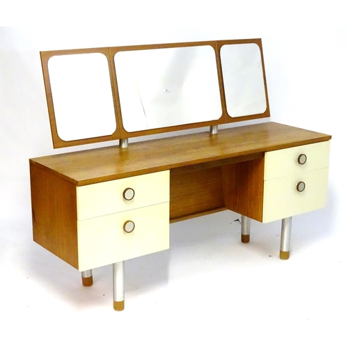 1228 - Vintage Retro, Mid Century: a 1970s teak and formica dressing table with triptych mirror and four dr... 