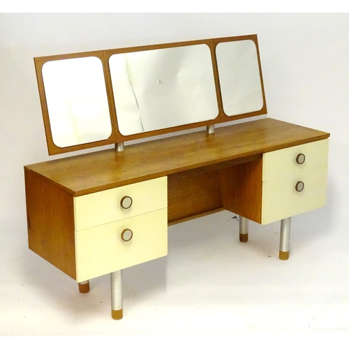 1228 - Vintage Retro, Mid Century: a 1970s teak and formica dressing table with triptych mirror and four dr... 